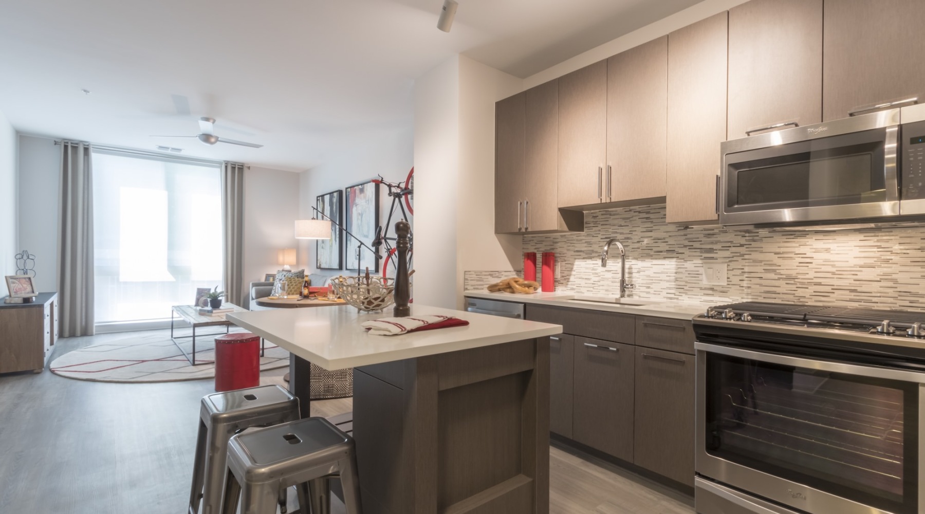 a kitchen with an island and chairs