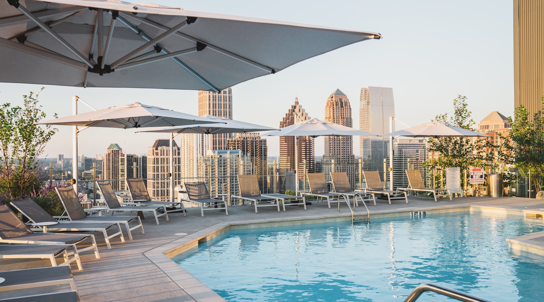 a swimming pool with lounge chairs