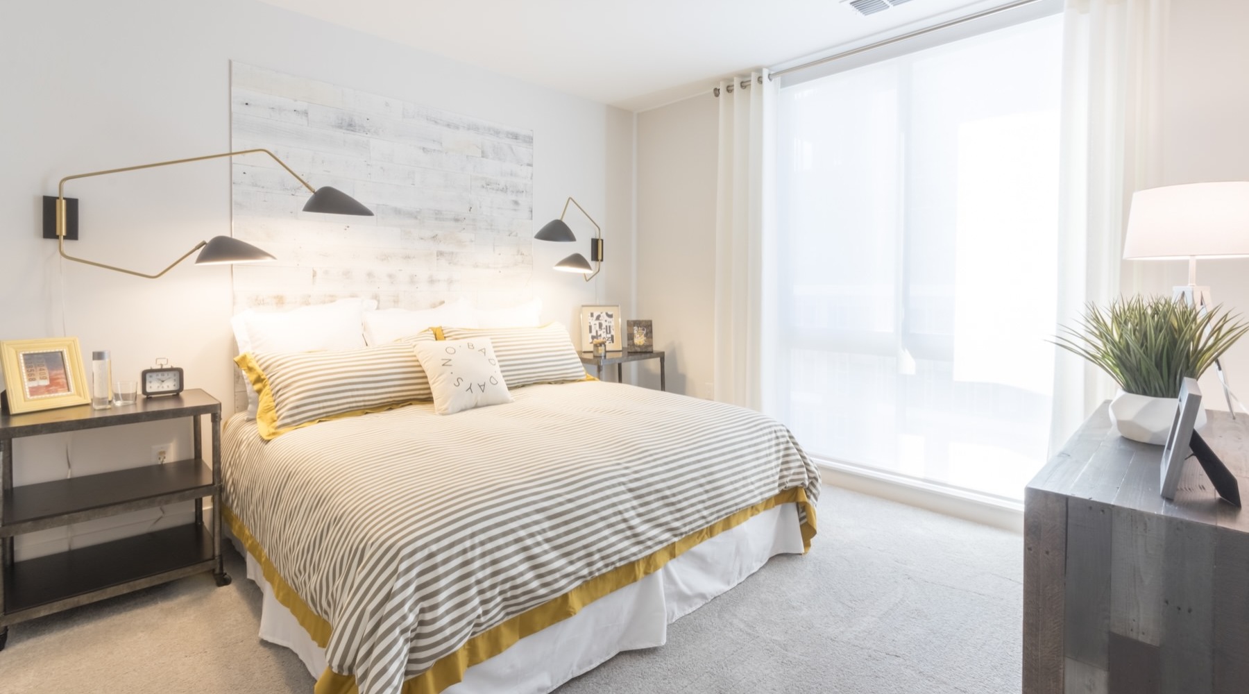 a bedroom with a bed and two nightstands