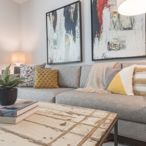 a living room with a couch and a rug